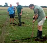 Picture of team members digging in cannons