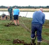 Picture of volunteers prepare the nets for a catch